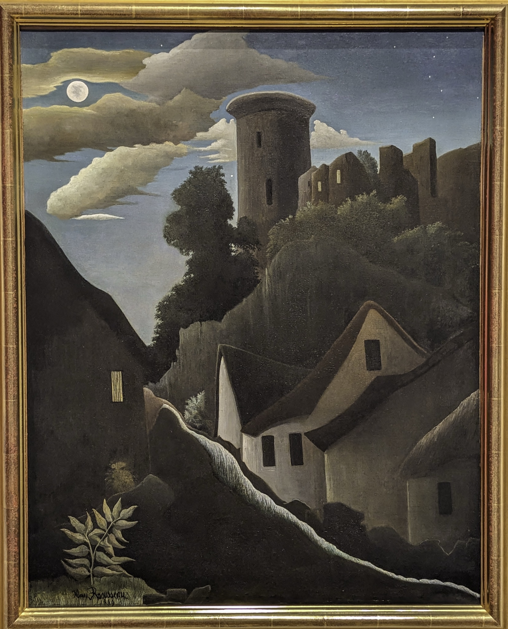 A gold-framed painting of a moonlit landscape with a stone tower and cottages on a hillside, signed Henri Rousseau 1889.